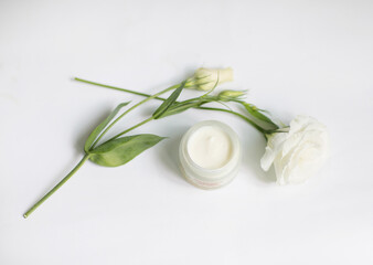 Cream in a jar on a white background