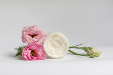 Cream in a jar on a white background
