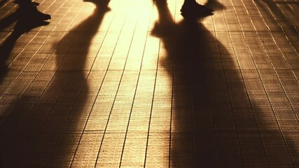 Slow motion of shadow of people walking on the street. 