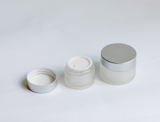 jar of cream on a white background