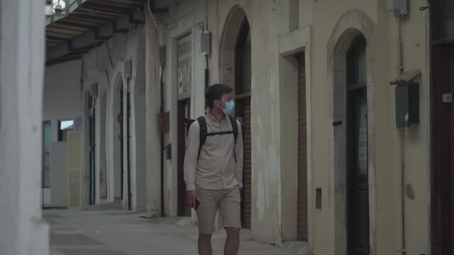 Main Market During Coronavirus Pandemic, No Tourists, Lockdown In Cyprus In City Paphos. Alone Tourist In Mask Walks Through Market And Looks At Closed Shops Due Covid 19. Small Business Bankruptcy.