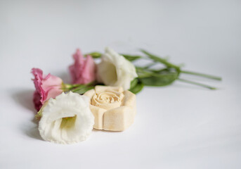 Obraz na płótnie Canvas Handmade bath soap with flowers on a white background