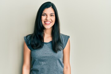 Obraz premium Young hispanic woman wearing casual clothes with a happy and cool smile on face. lucky person.