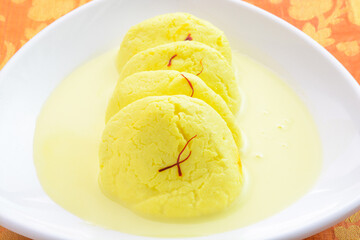 Ras malai also called as rossomalai is an Indian dessert dish.