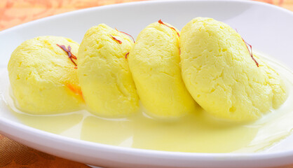 Ras malai also called as rossomalai is an Indian dessert dish.