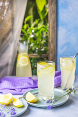 Glasses of lavender lemonade with cube ice with lavender flowers