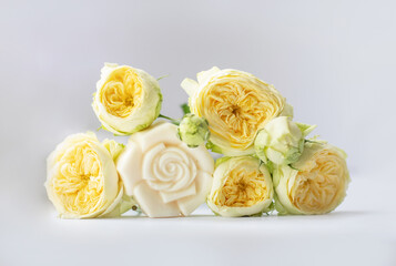 Handmade bath soap with flowers on a white background