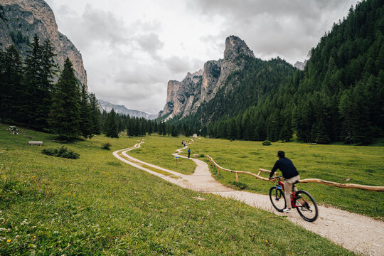 Popular valley of Langental or Vallunga in Dolomites, Selva, Italy. Summer view of Vallunga valley with turists doing outdoor activities.