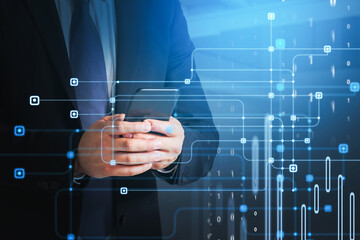 Businessman programmer in suit is typing a code on smartphone to protect a cyber security from hacker attacks and save clients confidential data. Hologram of binary circuit connections.