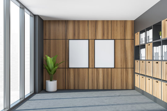 Two banners in the small grey office area with wooden tiling