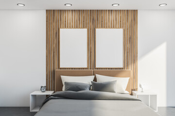 White bedroom with wood details. Two mockup posters