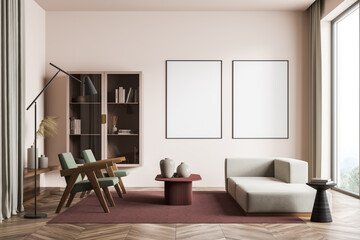 Modern living room interior with wooden floor and big window. Two mock up empty posters on the wall. Concept of contemporary design.