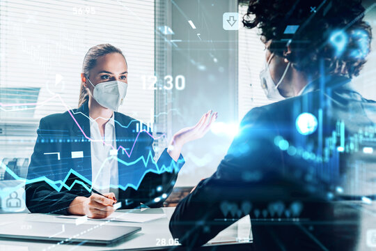 Businessman and businesswoman in face protective masks on job interview. Looking for new talented candidates for corporate company. Hologram elements of business process. Recruitment department