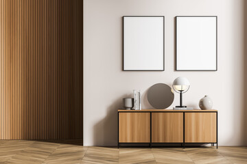 Two white posters in beige living room with wooden coating, sideboard