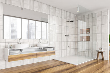 Corner of shower room with grey beige tiling