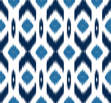Abstract . Ikat seamless pattern traditional. line indigo on white background. design for pillow, print, fashion, clothing, fabric, gift wrap.  Vector.