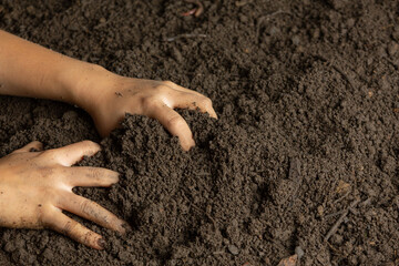 Hand holding black soil for cultivating crops world soil day concept