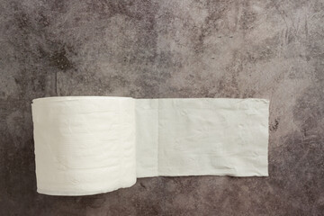 Pure white toilet paper rolls on the floor.