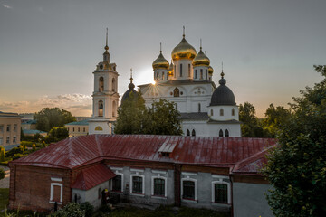 Fototapeta na wymiar Uspensky Cathedral in Dmitrov near Moscow, Russia, with sunrays shining through