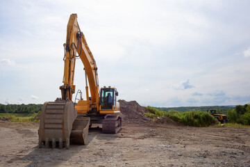Fototapeta na wymiar construction digger excavator yellow hydraulic equipment trackhoe machine