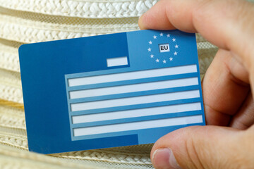 European health insurance card in your hand. Concept, Travel insurance, Vacation security,...