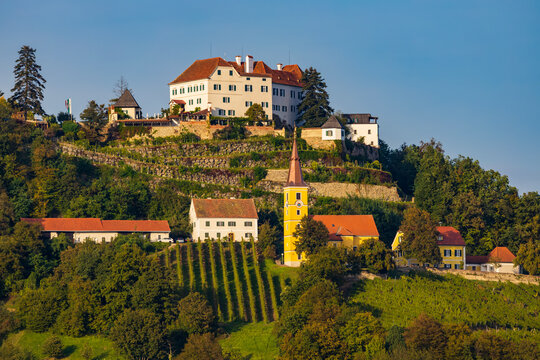 Kapfenstein castle and church with vineyard, Styria, Austria