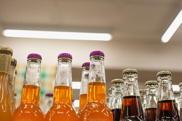 Colorful alcohol drinks bottlenecks close up. Alcohol shop shelves. 