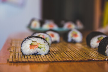 Ready-made homemade sushi, rolls lie on the mat