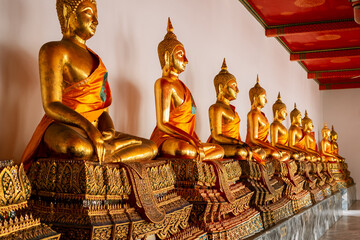 Golden statues of Buddha on the grounds of the Grand Palace, Bangkok, Thailand