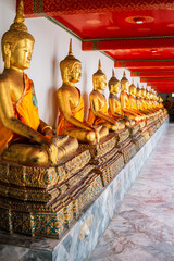 Golden statues of Buddha on the grounds of the Grand Palace, Bangkok, Thailand