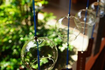 Wind‐bell or wind-chime, hanging bell made of glasses rings in the wind, image of Summer in Japan...