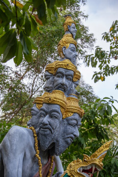 Many heads statue on the street near buddhist temple, Thailand