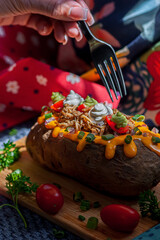 Homemade baked stuffed potato with organic