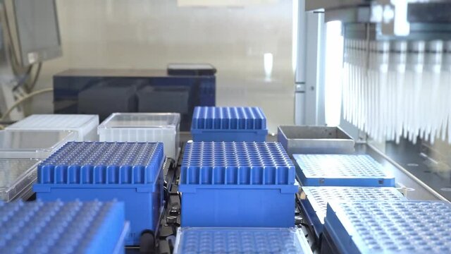 Automation in the clinical laboratory. Pipetting robot laboratory. Medicine robotics. automated pharmaceutical laboratory. Research and science background