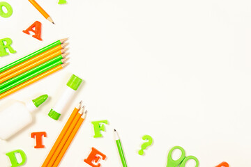 School supplies on a light background. Mock up for your design with copy space.