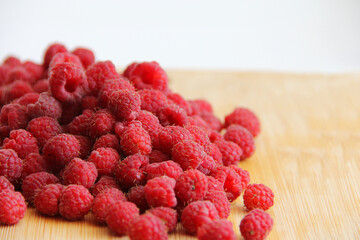 fresh raspberries on a white background close-up