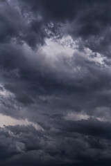 Naklejka na ściany i meble Storm sky with dark grey black epic clouds background texture, hurricane with thunderstorm, cyclone