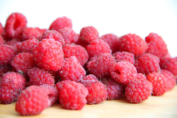 fresh raspberries on a white background close-up