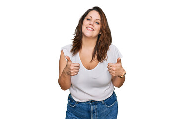 Young plus size woman wearing casual white t shirt success sign doing positive gesture with hand,...