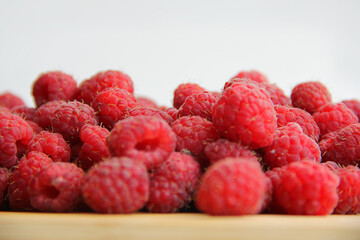 fresh raspberries on a white background close-up