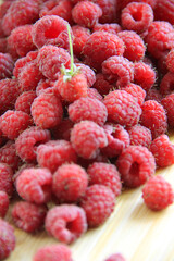 fresh raspberries on a white background close-up