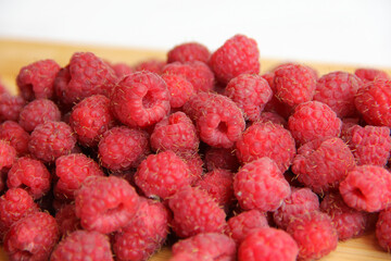 fresh raspberries on a white background close-up