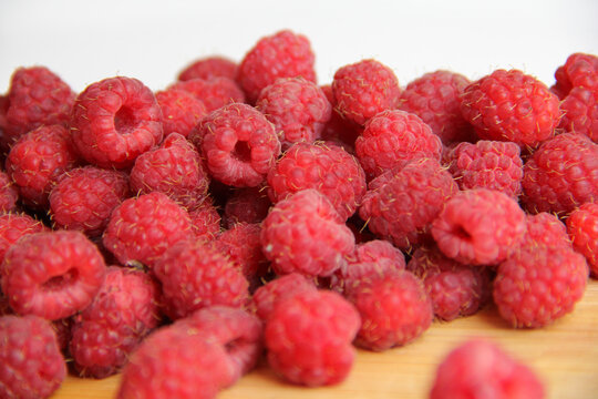 fresh raspberries on a white background close-up