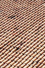 old weathered red roof tiles.
