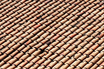 old weathered red roof tiles.