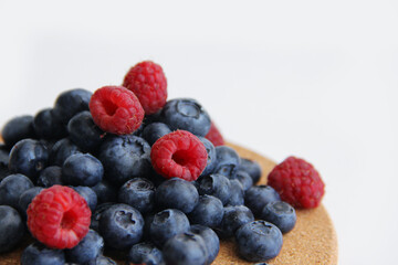 blueberries and raspberries on a plate