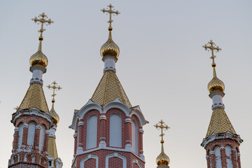 Fototapeta na wymiar Domes with crosses, the top of the church is turned to the east. Orthodox Christian religion