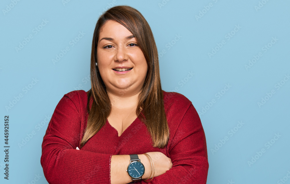 Wall mural Beautiful brunette plus size woman wearing casual clothes happy face smiling with crossed arms looking at the camera. positive person.