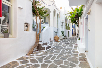 Paros island, Greece. Whitewashed buildings, narrow cobblestone streets - obrazy, fototapety, plakaty