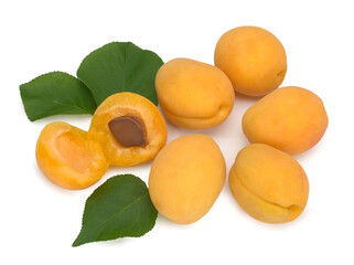 Ripe orange apricots with leaves on white background. Isolated